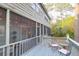 Exterior screened in porch offers comfortable seating and views of the surrounding landscape at 1050 Marsh Court Ln, Mount Pleasant, SC 29464