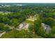 An aerial view showcasing the property nestled among lush greenery and a tranquil neighborhood setting at 106 Swanson Dr, Summerville, SC 29483