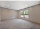 A well-lit bedroom with neutral carpet and two windows providing natural light at 106 Swanson Dr, Summerville, SC 29483