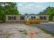 Charming manufactured home showcasing a cozy front porch and well-lit windows at 106 Swanson Dr, Summerville, SC 29483