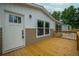 A charming home exterior featuring a welcoming front door and a spacious wooden deck with ample sunlight at 106 Swanson Dr, Summerville, SC 29483