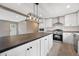 Modern kitchen with stainless appliances, an island, and white cabinetry at 106 Swanson Dr, Summerville, SC 29483