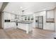 Bright, modern kitchen features stainless steel appliances, an island and white cabinetry at 106 Swanson Dr, Summerville, SC 29483