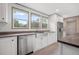 Modern kitchen with stainless steel dishwasher and farmhouse style sink at 106 Swanson Dr, Summerville, SC 29483
