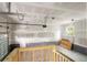 Spacious three-car garage with an unfinished ceiling, exposed walls, and a door to the backyard at 1076 Williams Rd, Charleston, SC 29412