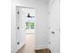 Hallway opens to a bedroom with natural light and closet doors, with an en suite bathroom at 1076 Williams Rd, Charleston, SC 29412