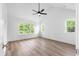 Spacious main bedroom with large windows and a ceiling fan at 1076 Williams Rd, Charleston, SC 29412
