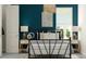 A bedroom featuring a stylish bed, bedside tables with lamps, and vibrant wall decor at 1130 Darling St, Summerville, SC 29485