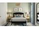 Cozy bedroom with a comfortable bed, bedside tables with lamps, and stylish decor at 1130 Darling St, Summerville, SC 29485