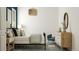 A charming bedroom featuring a comfortable bed, dresser, stylish decor and lots of light at 1130 Darling St, Summerville, SC 29485