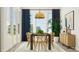 Elegant dining room with modern table, stylish wooden chairs, contemporary lighting, and large windows at 1130 Darling St, Summerville, SC 29485