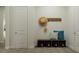 An inviting entryway features a decorative bench with pillows and storage for hats and other accessories at 1130 Darling St, Summerville, SC 29485