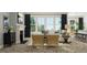 Inviting living room featuring a cozy fireplace, plush seating, and large windows that offer abundant natural light at 1130 Darling St, Summerville, SC 29485