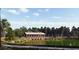Scenic view of a wooden covered bridge next to a peaceful pond with a walking path and greenery at 1130 Darling St, Summerville, SC 29485