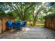 Deck with chairs and table surrounded by trees with a water view at 1166 Julian Clark Rd, Charleston, SC 29412