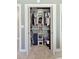 Walk-in closet with ample storage, including shelves and hanging rods at 1166 Julian Clark Rd, Charleston, SC 29412