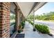 Welcoming porch with plants, a rug, and a view of the neighborhood beyond at 1166 Julian Clark Rd, Charleston, SC 29412