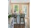 Bright kitchen island with modern sink, faucet and seating and view of the door to the patio at 1166 Julian Clark Rd, Charleston, SC 29412