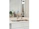 Modern kitchen sink with faucet and open view into the dining and living room at 1166 Julian Clark Rd, Charleston, SC 29412