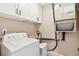 A laundry room featuring a new washer and dryer, cabinets, and modern connections at 1166 Julian Clark Rd, Charleston, SC 29412