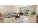Cozy living room featuring a comfortable sofa, armchair, area rug, and natural light at 1166 Julian Clark Rd, Charleston, SC 29412