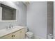 This renovated bathroom features modern tile, a new vanity, and ample lighting at 127 Cornell Dr, Ladson, SC 29456