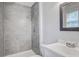 This bathroom features a newly tiled shower and modern vanity, creating a spa-like retreat at 127 Cornell Dr, Ladson, SC 29456