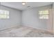 Carpeted bedroom features neutral walls and natural light, creating a calming atmosphere at 127 Cornell Dr, Ladson, SC 29456