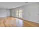Bright living room featuring beautiful hardwood floors, large windows, and neutral wall color at 127 Cornell Dr, Ladson, SC 29456
