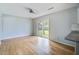 Living area with wood floors and sliding door to backyard at 127 Cornell Dr, Ladson, SC 29456