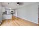 Open floor plan living space with wood flooring, kitchen, and plenty of light at 127 Cornell Dr, Ladson, SC 29456