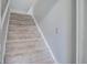 Carpeted staircase leading to upper level of home at 127 Cornell Dr, Ladson, SC 29456