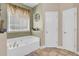 Bathroom featuring a tub, window, and neutral paint at 172 Cotillion Cresent Cres, Summerville, SC 29483