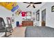 A themed bedroom featuring sports memorabilia, dresser, and ceiling fan at 172 Cotillion Cresent Cres, Summerville, SC 29483