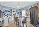 Inviting dining room with blue walls, wood floors, and decorative artwork displayed at 172 Cotillion Cresent Cres, Summerville, SC 29483