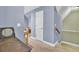 Upstairs hallway featuring carpet floors and blue accent wall with white trim at 172 Cotillion Cresent Cres, Summerville, SC 29483