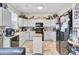 Fully-equipped kitchen with light cabinets, tile flooring, and functional black appliances at 172 Cotillion Cresent Cres, Summerville, SC 29483