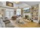Spacious living room with fireplace, built-ins, hardwood floors, and cozy seating at 172 Cotillion Cresent Cres, Summerville, SC 29483