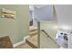 Carpeted stairway featuring wood railing leads to the upper level of the home at 172 Cotillion Cresent Cres, Summerville, SC 29483