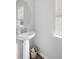 Bathroom with white vanity and pedestal sink at 1825 Crossbill Trl, Hanahan, SC 29410