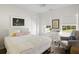 Bright bedroom featuring a cozy chair, charming desk area, and large windows providing ample natural light at 1825 Crossbill Trl, Hanahan, SC 29410