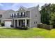 A beautiful home with a brick facade, manicured lawn, inviting porch, and fenced yard, perfect for Gathering living at 1825 Crossbill Trl, Hanahan, SC 29410