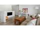 Cozy living room featuring a couch and a TV mounted on the wall at 1825 Crossbill Trl, Hanahan, SC 29410