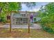 Outdoor living space with a screened porch and patio, ideal for entertaining at 202 Hunt Club Dr, Summerville, SC 29485