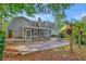 Large backyard with a wooden pergola with hanging plants and a screen porch is perfect for outdoor enjoyment at 202 Hunt Club Dr, Summerville, SC 29485