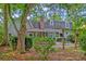 Backyard patio featuring lush greenery and a tranquil space for outdoor enjoyment at 202 Hunt Club Dr, Summerville, SC 29485