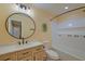 Well-lit bathroom with a modern vanity, round mirror, and tiled shower area for a spa-like feel at 202 Hunt Club Dr, Summerville, SC 29485