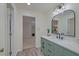 A stylish bathroom features a modern vanity with a marble countertop and a sleek, framed mirror at 202 Hunt Club Dr, Summerville, SC 29485