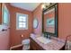 Cozy bathroom with granite counters, classic mirror, and updated fixtures at 202 Hunt Club Dr, Summerville, SC 29485