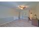 A well-lit bedroom features a ceiling fan, a large closet, and a desk for a flexible living space at 202 Hunt Club Dr, Summerville, SC 29485